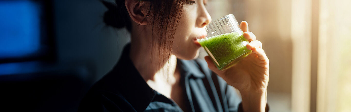 woman with green juice