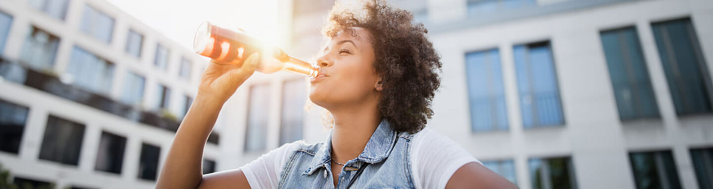 Person drinking from a bottle