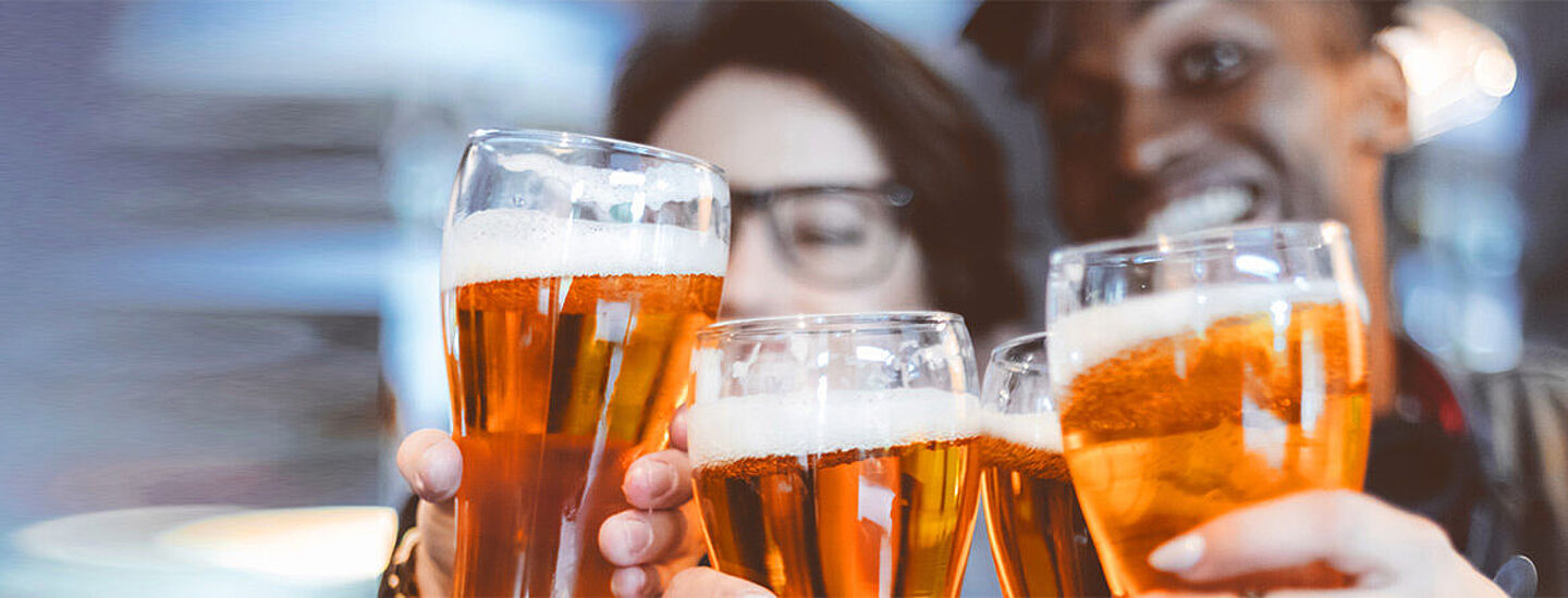 People toasting with beers