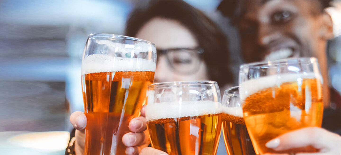 People toasting with beers