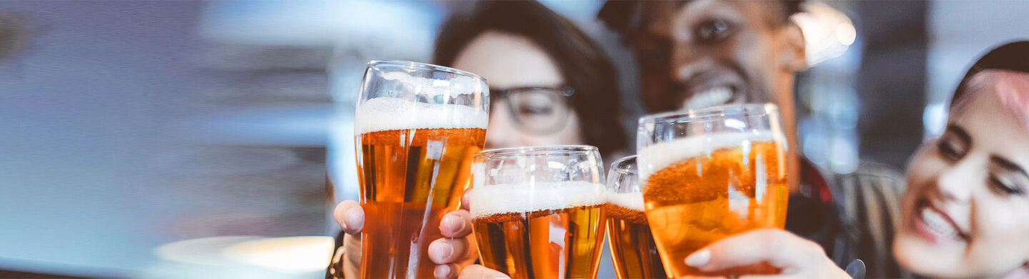 People toasting with beers
