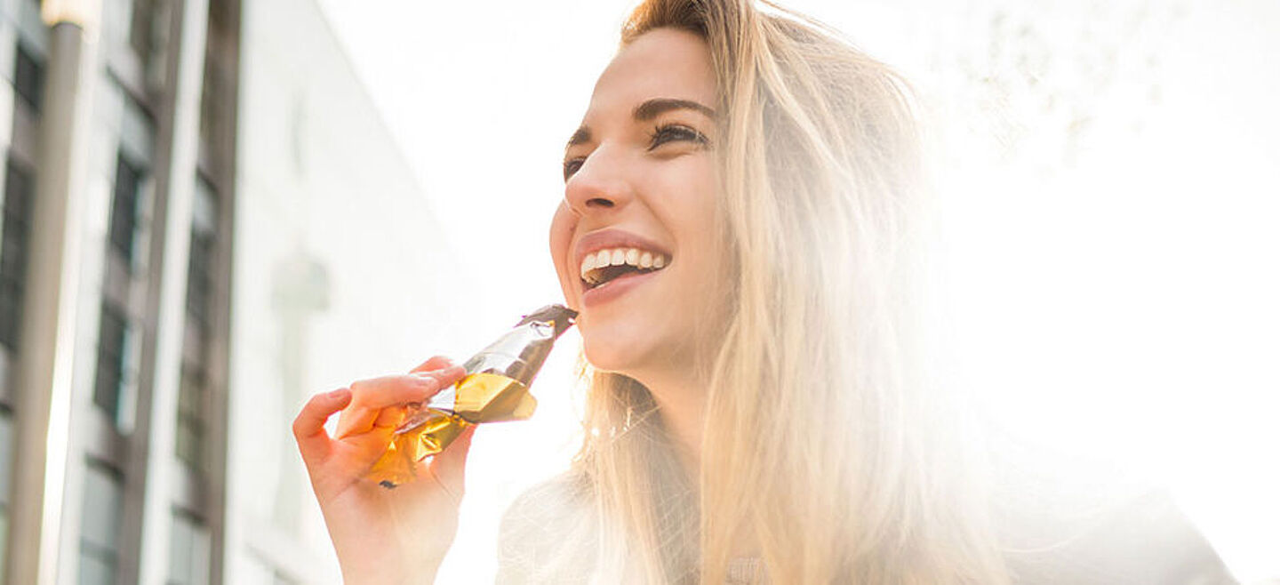 girl eating a cereal bar