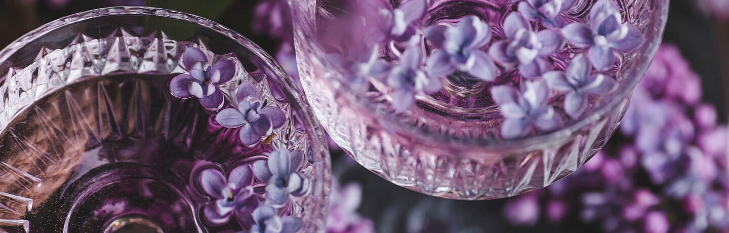 glass with water and purple botanical