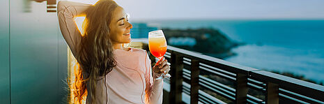 girl drinking orange drink