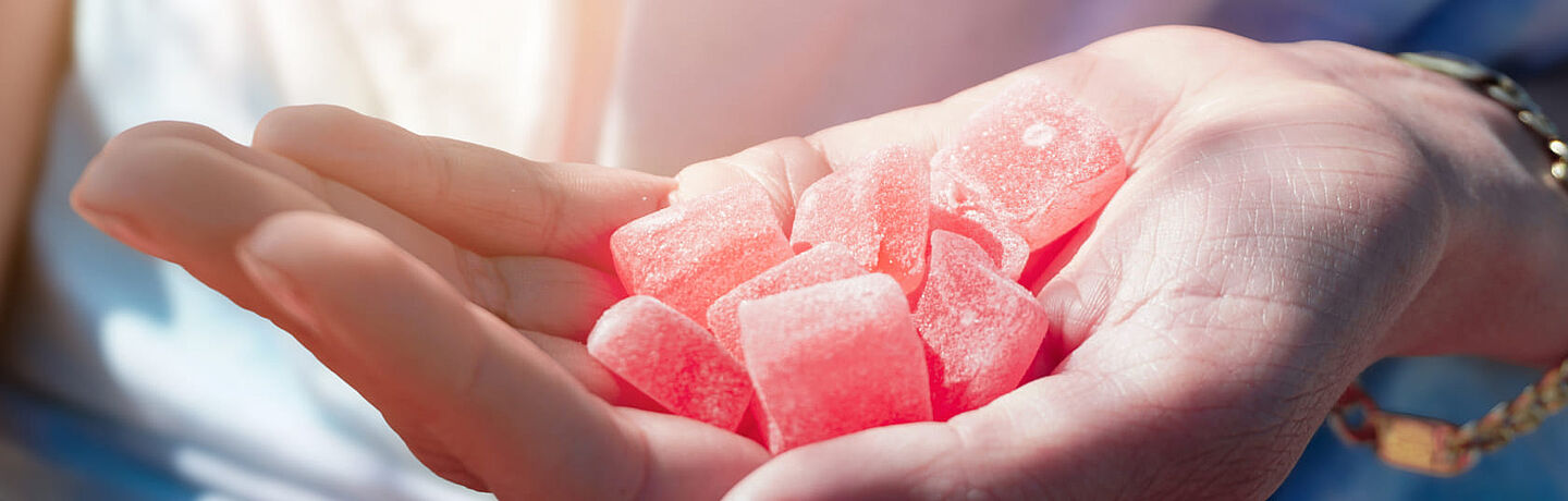 pink candies in a hand