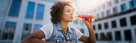 girl drinking from the bottle